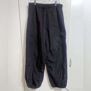 Pink Windbreaker material black pants